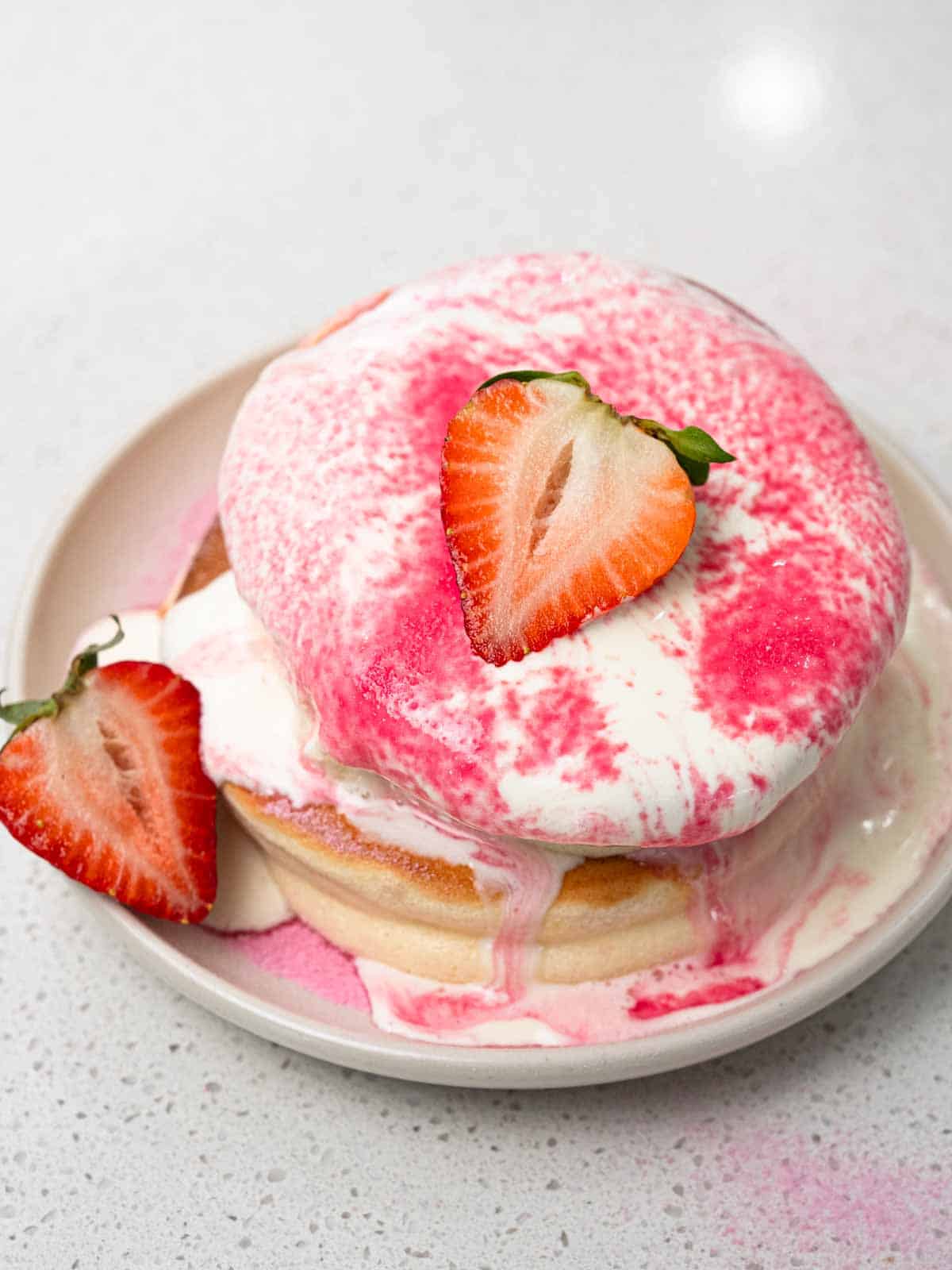 japanese souffle pancakes with whipped cream and strawberries
