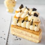 Passionfruit and White chocolate mousse cake with black sesame praline