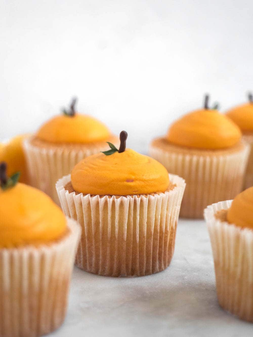 Mandarin shaped cotton-soft chiffon cupcakes with citrus whipped cream