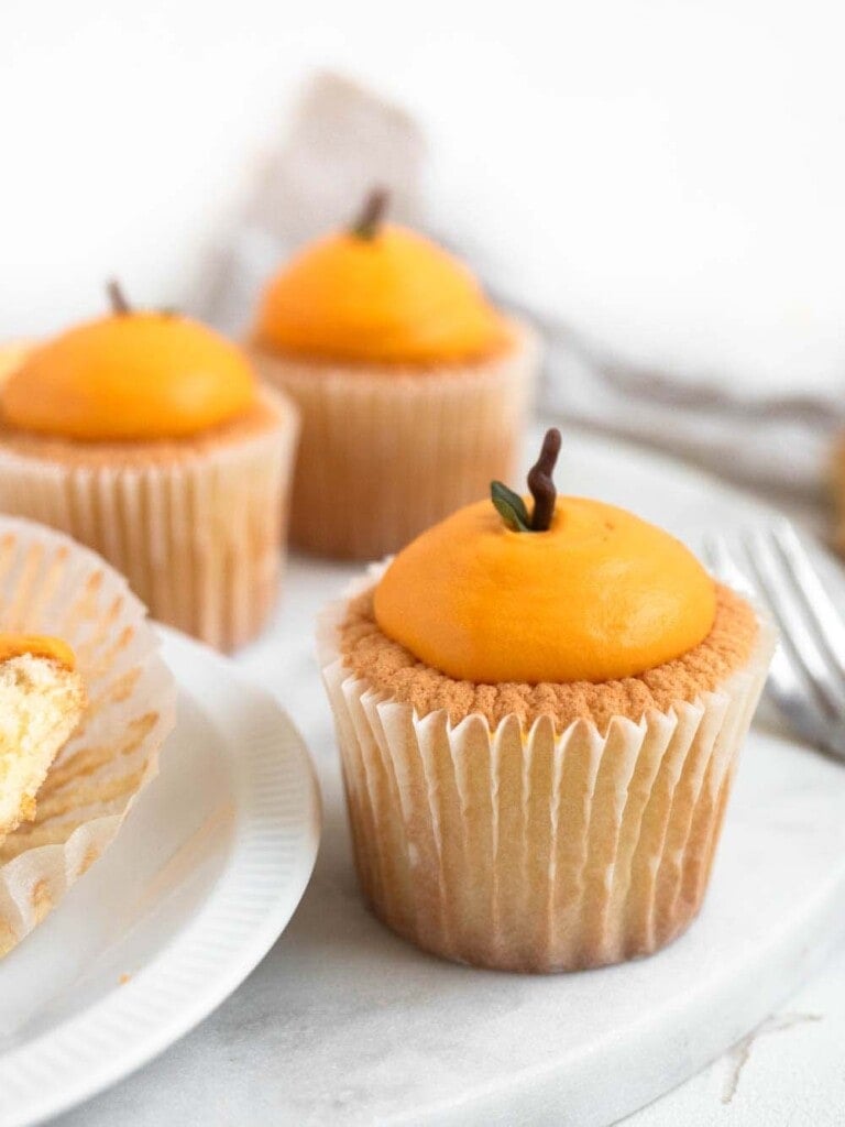 Mandarin shaped cotton-soft chiffon cupcakes with citrus whipped cream
