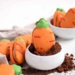 Carrot shaped macarons filled with carrot cake cream cheese buttercream easter cookies