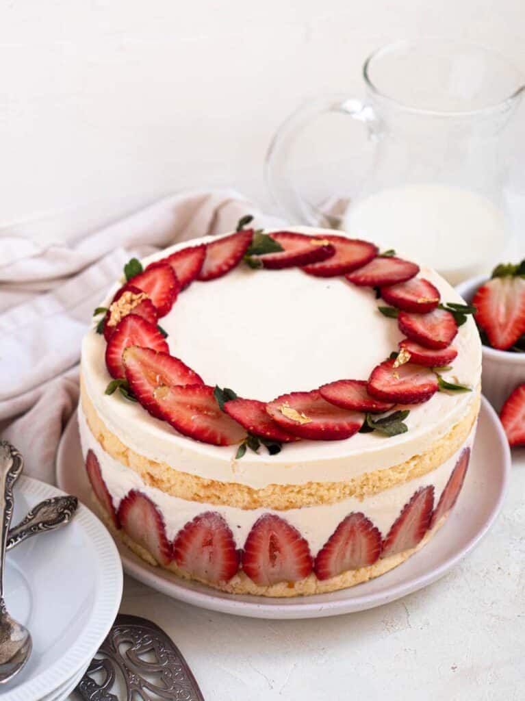 Frasier cake with strawberries, pastry cream and whipped cream in a soft and fluffy sponge cake 