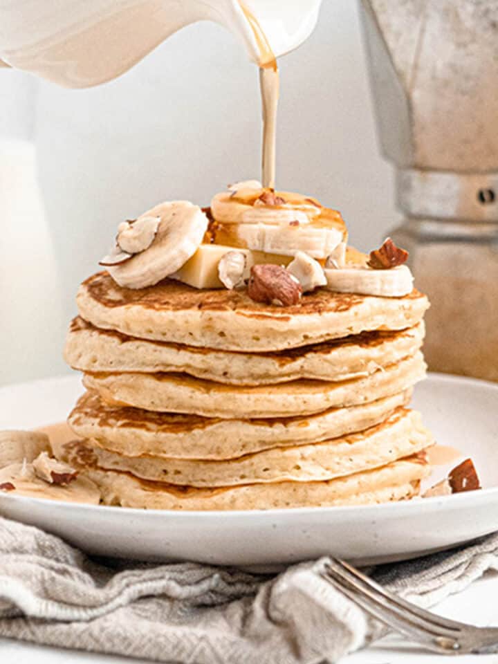 Easy soft and fluffy pancakes with banana and maple syrup