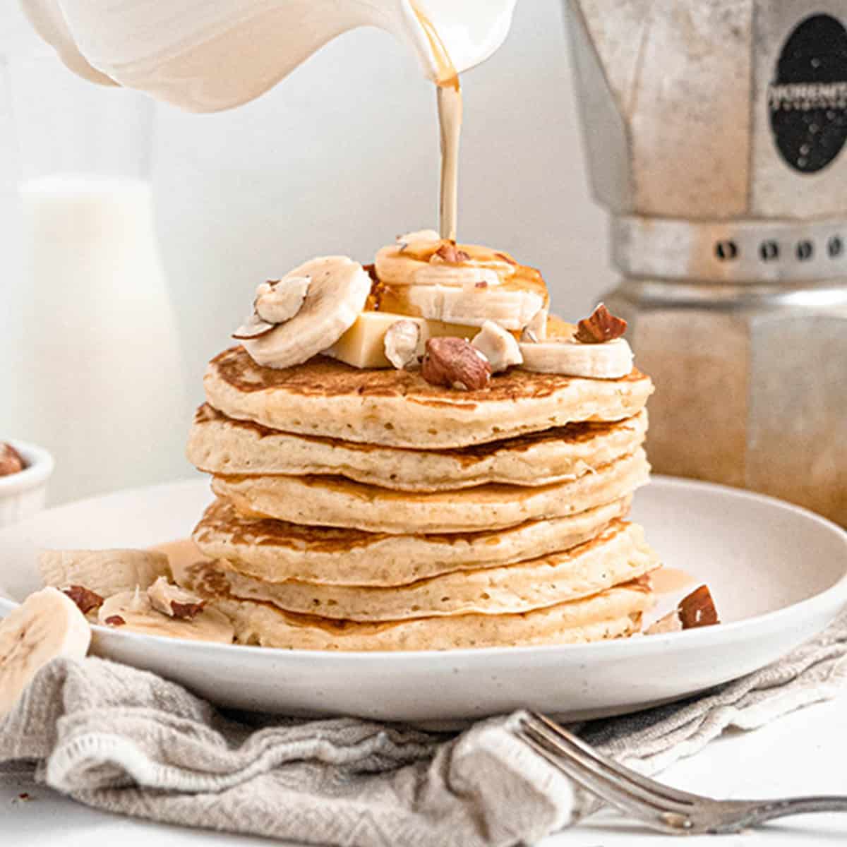 Easy soft and fluffy pancakes with banana and maple syrup