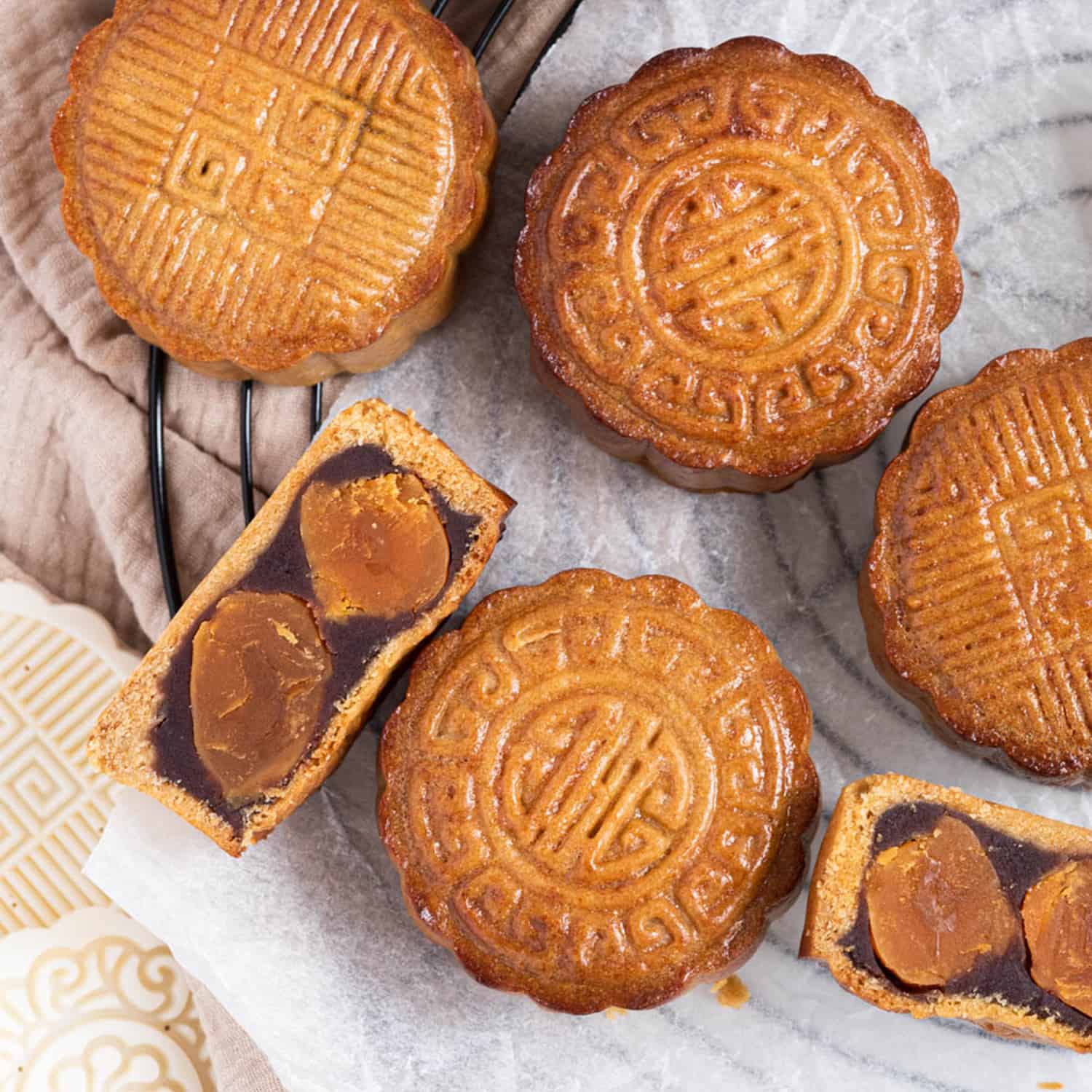Traditional cantonese style baked mooncakes with chestnut and red bean paste and double salted duck 
