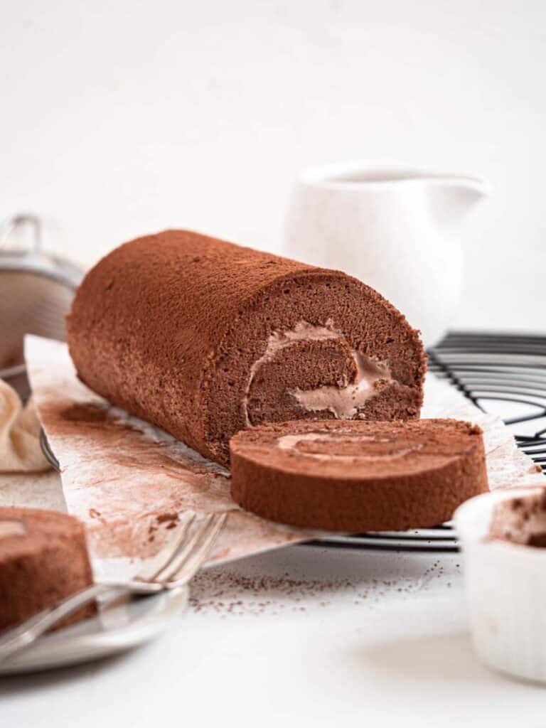 Chocolate Swiss roll cake filled with light chocolate whipped cream