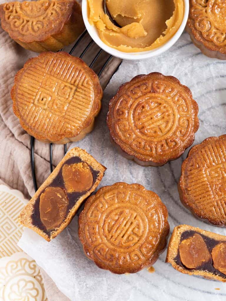 Traditional cantonese style baked mooncakes with chestnut and red bean paste and double salted duck yolks