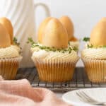Lemon curd filled easter white chocolate cupcakes with a golden egg