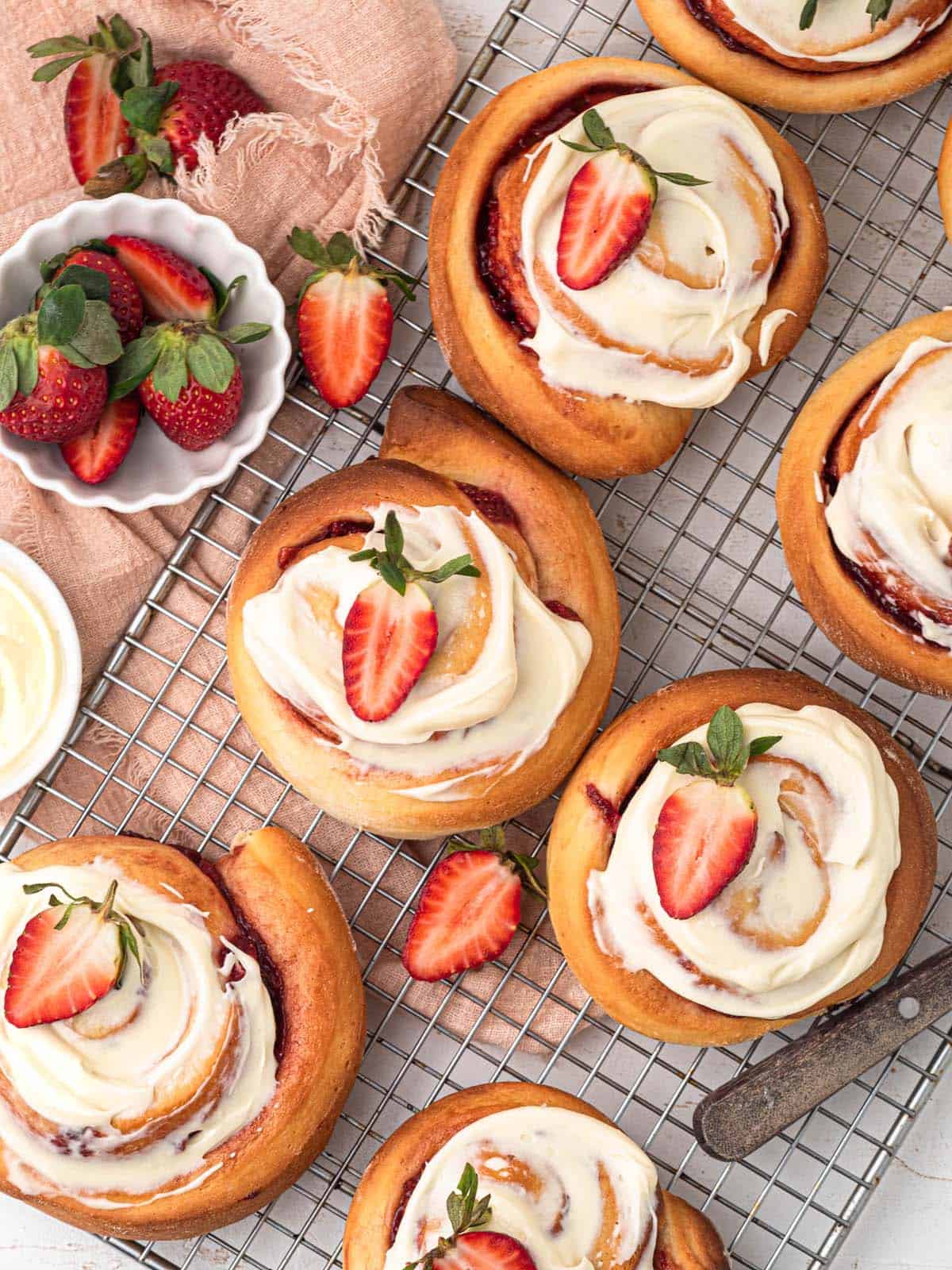 strawberry cinnamon jam rolls with cream cheese frosting