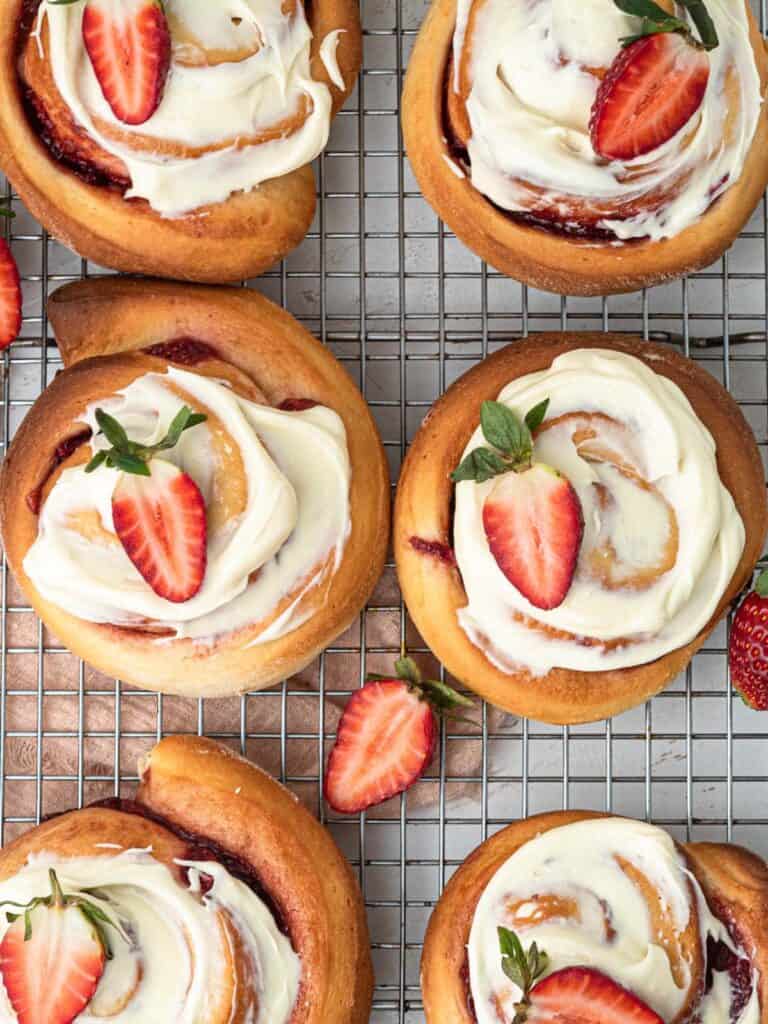 strawberry cinnamon jam rolls with cream cheese frosting
