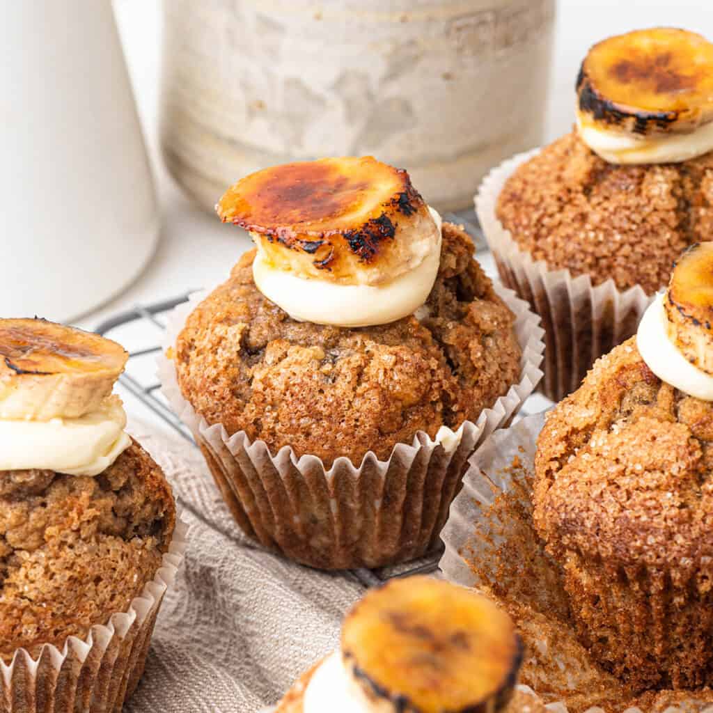 Banana cinnamon muffins with cream cheese frosting and caramelised bananas
