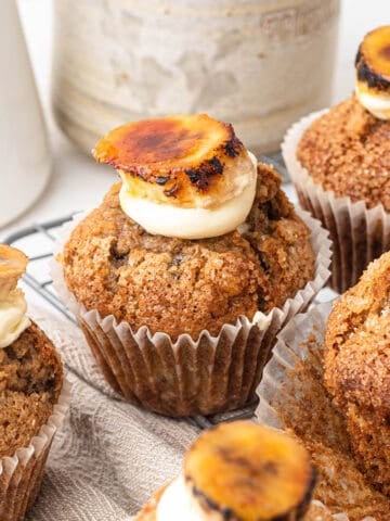 Banana cinnamon muffins with cream cheese frosting and caramelised bananas