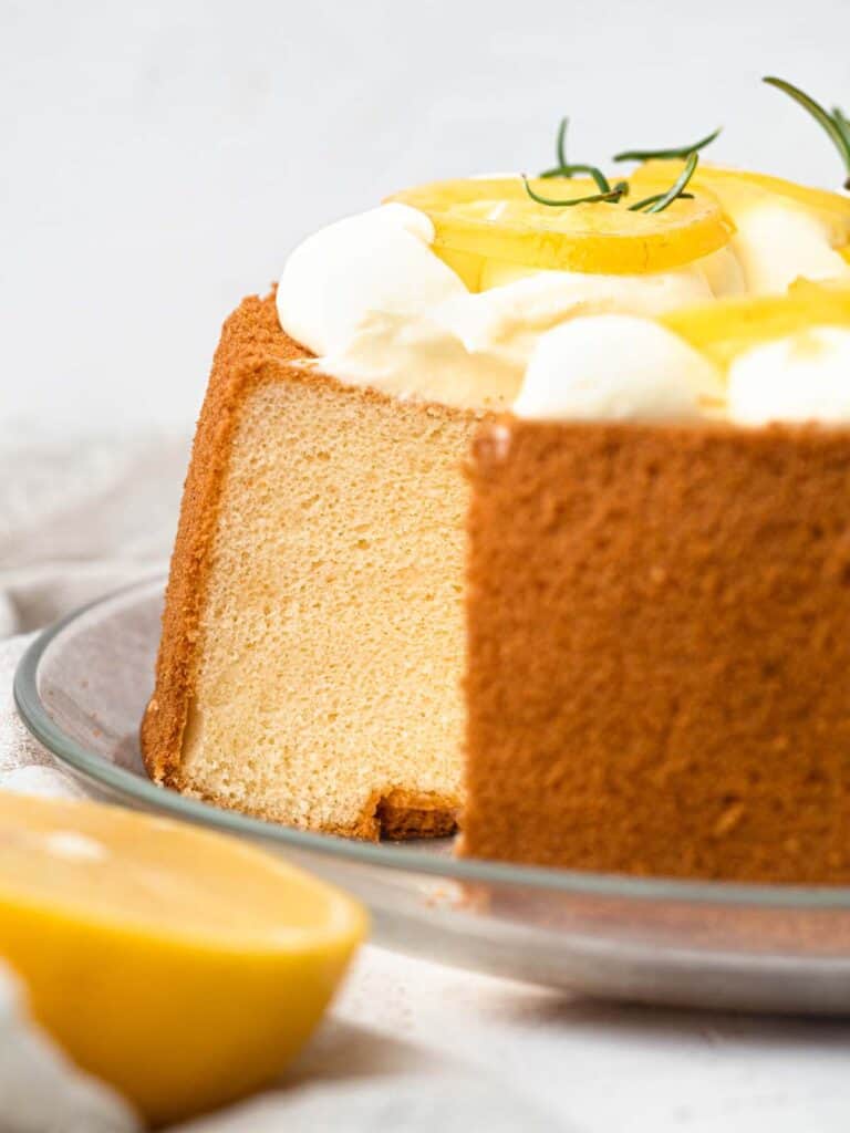 Lemon chiffon sponge cake with whipped cream and candied lemons