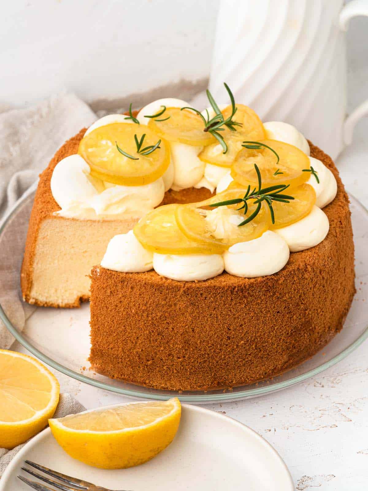 Lemon chiffon sponge cake with whipped cream and candied lemons