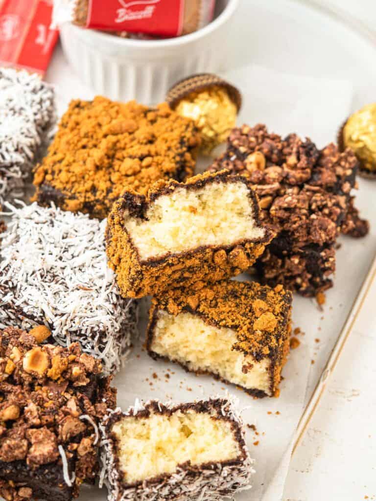 Australian lamingtons rolled in chocolate glaze and coconut, biscoff and Ferrero rochers