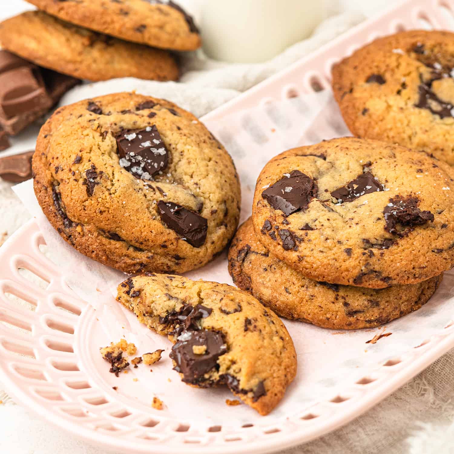 chocolate chip cookies with chunks of dark chocolate topped with flaky salt