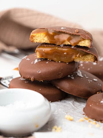 Twix candy bar inspired shortbread cookies filled with caramel coated with chocolate