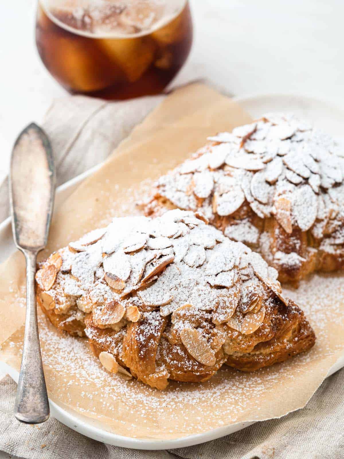 Small batch almond croissants dusted in icing sugar