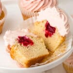Vanilla cupcakes filled with raspberry jam topped with raspberry cream cheese frosting