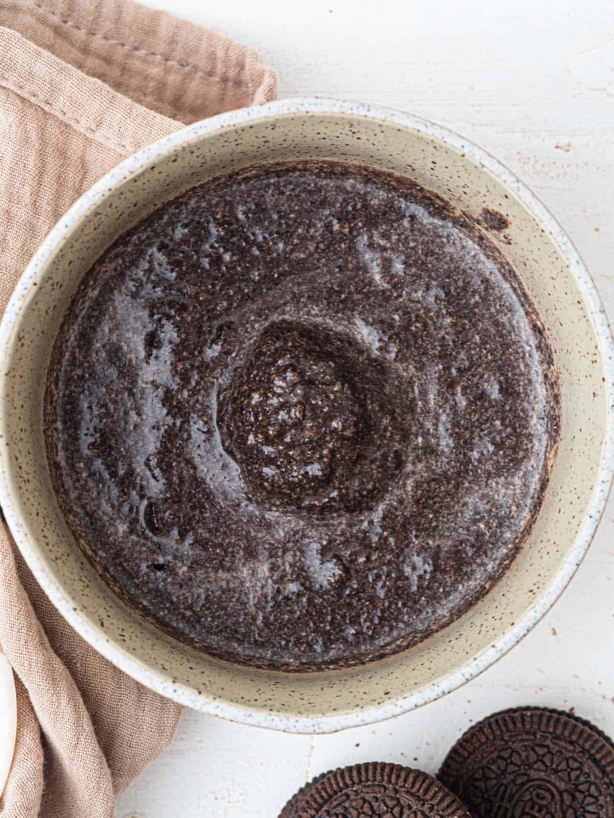 Microwave Oreo Lava Mug Cake with Ice cream an a molten chocolate center