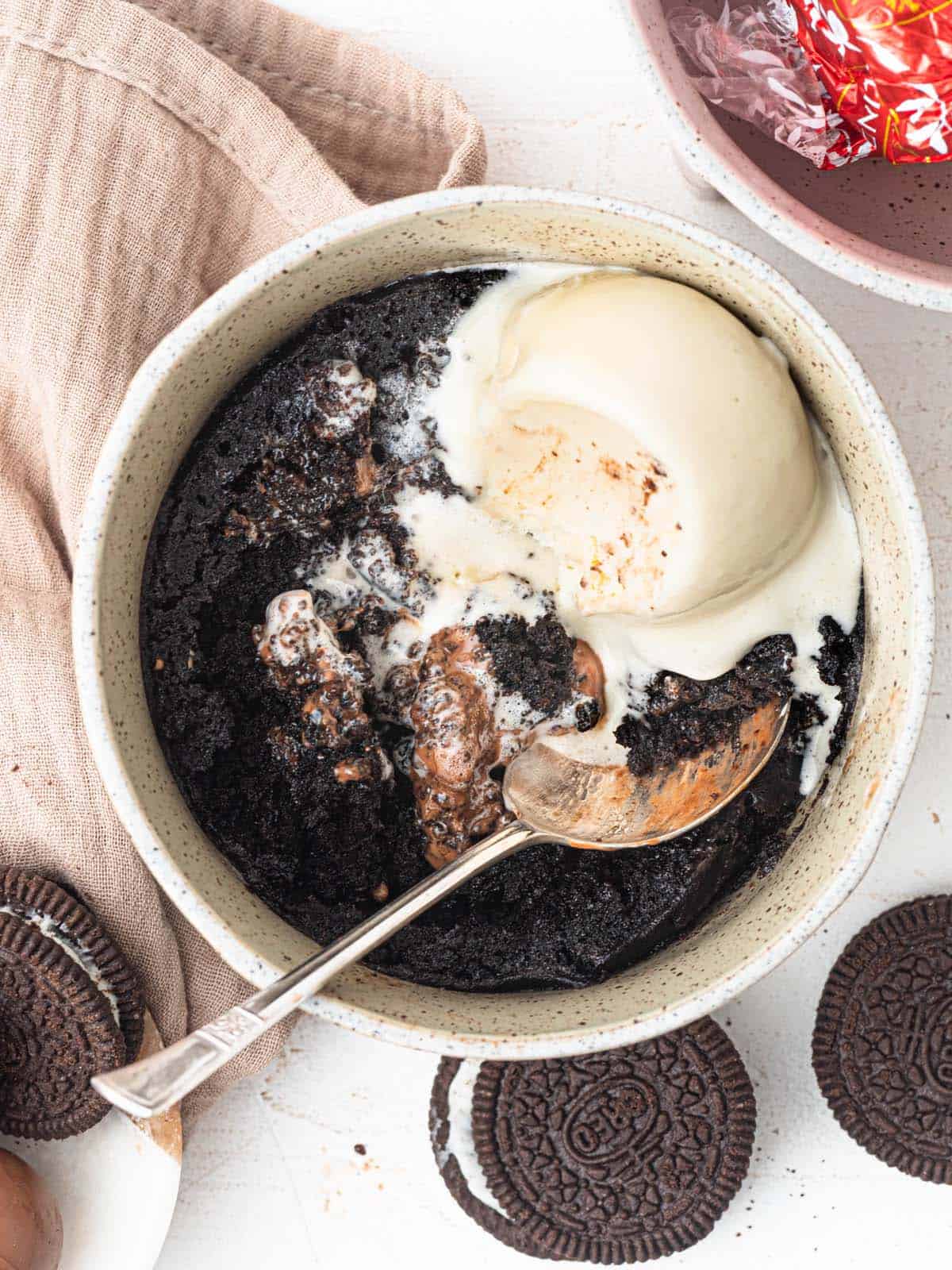 Microwave Oreo Lava Mug Cake with Ice cream an a molten chocolate center