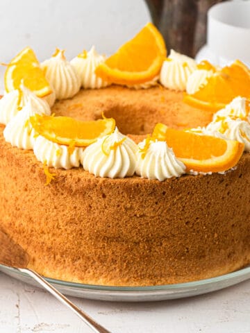 Orange chiffon cake topped with whipped cream