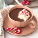 christmas peppermint french hot chocolate with whipped cream and candy canes