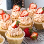 pink champagne cupcakes topped with buttercream and strawberries