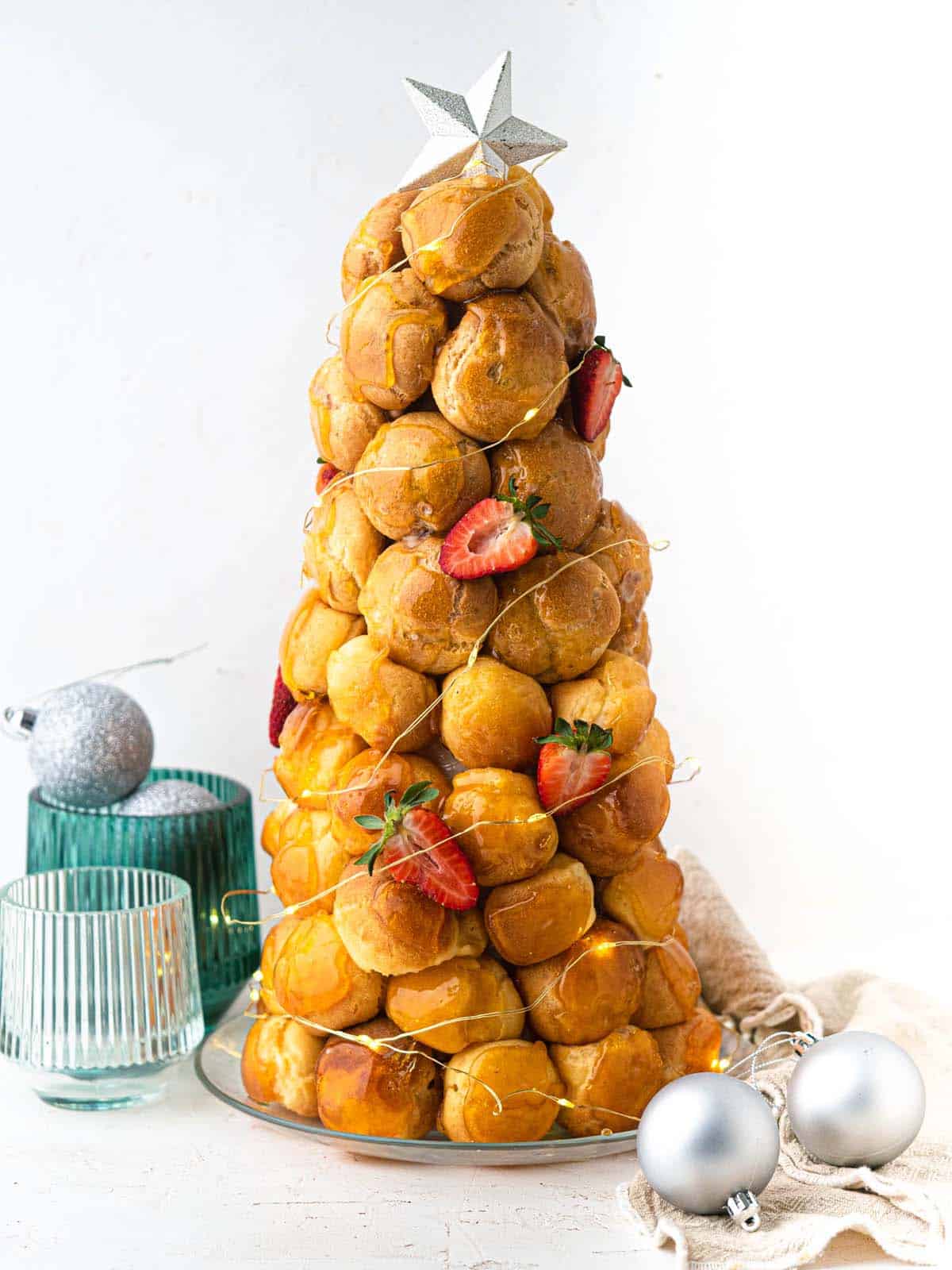 croquembouche with cream puffs filled with pastry cream and topped with caramel