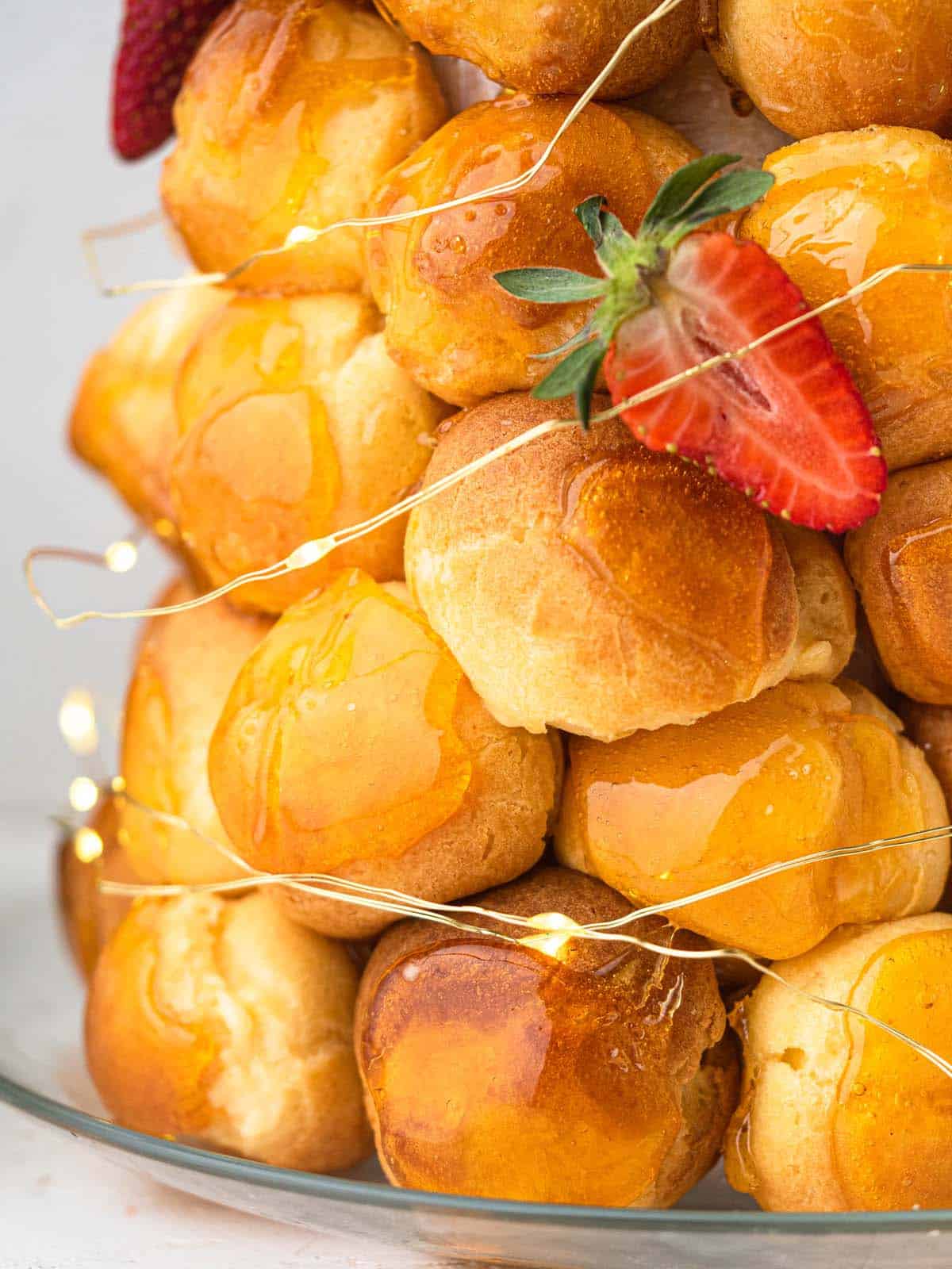 croquembouche with cream puffs filled with pastry cream and topped with caramel