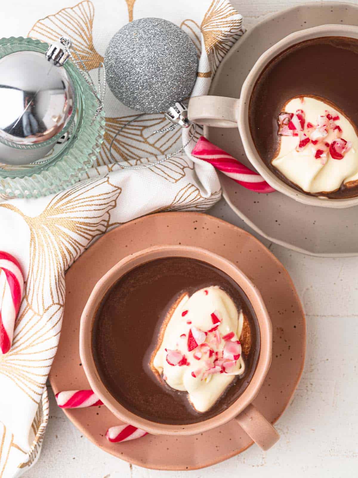 christmas peppermint french hot chocolate with whipped cream and candy canes
