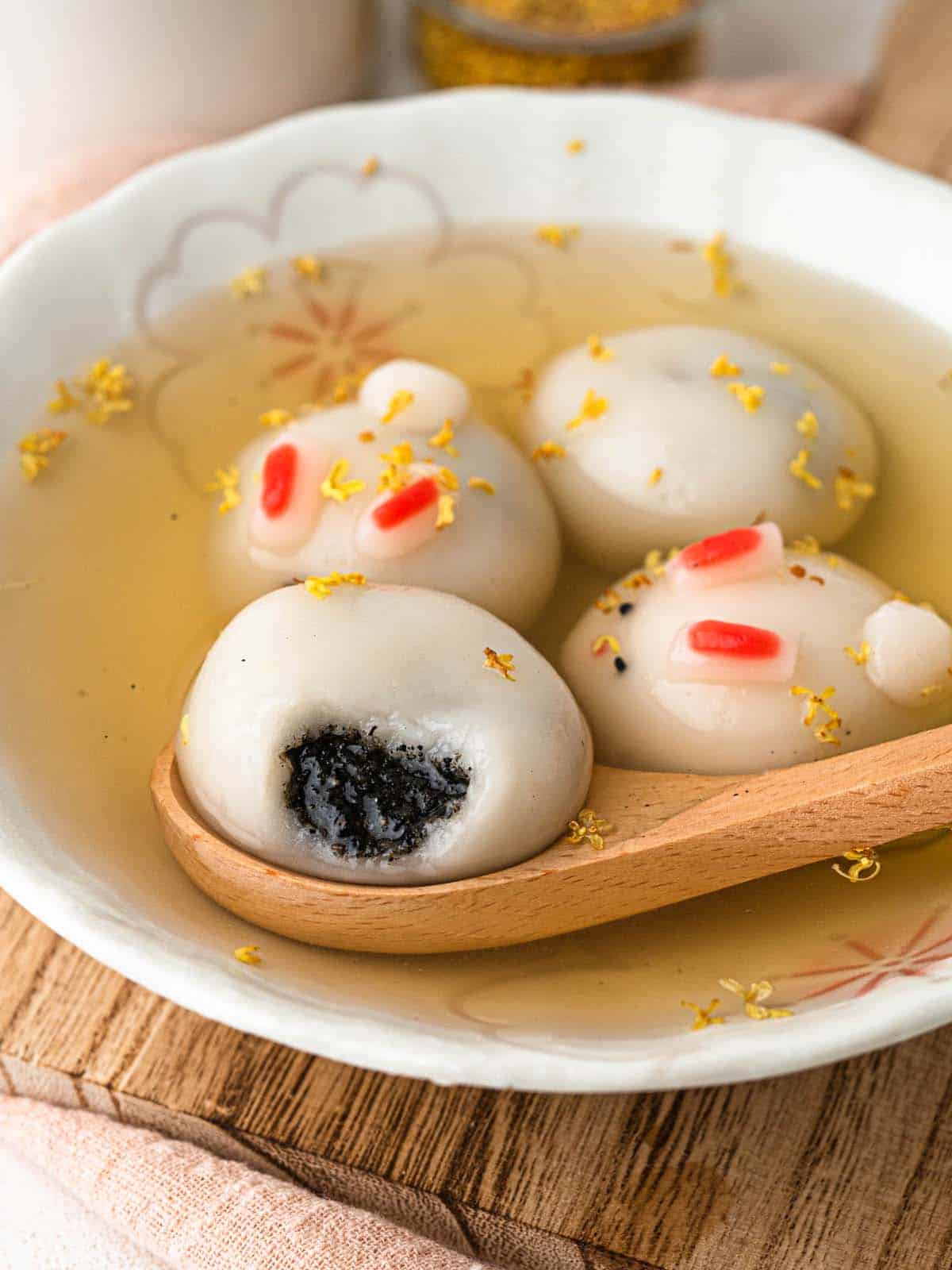 bunny shaped tang yuan filled with black sesame in ginger soup