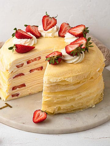 strawberry mille crepe cake filled with vanilla whipped cream and fresh strawberries