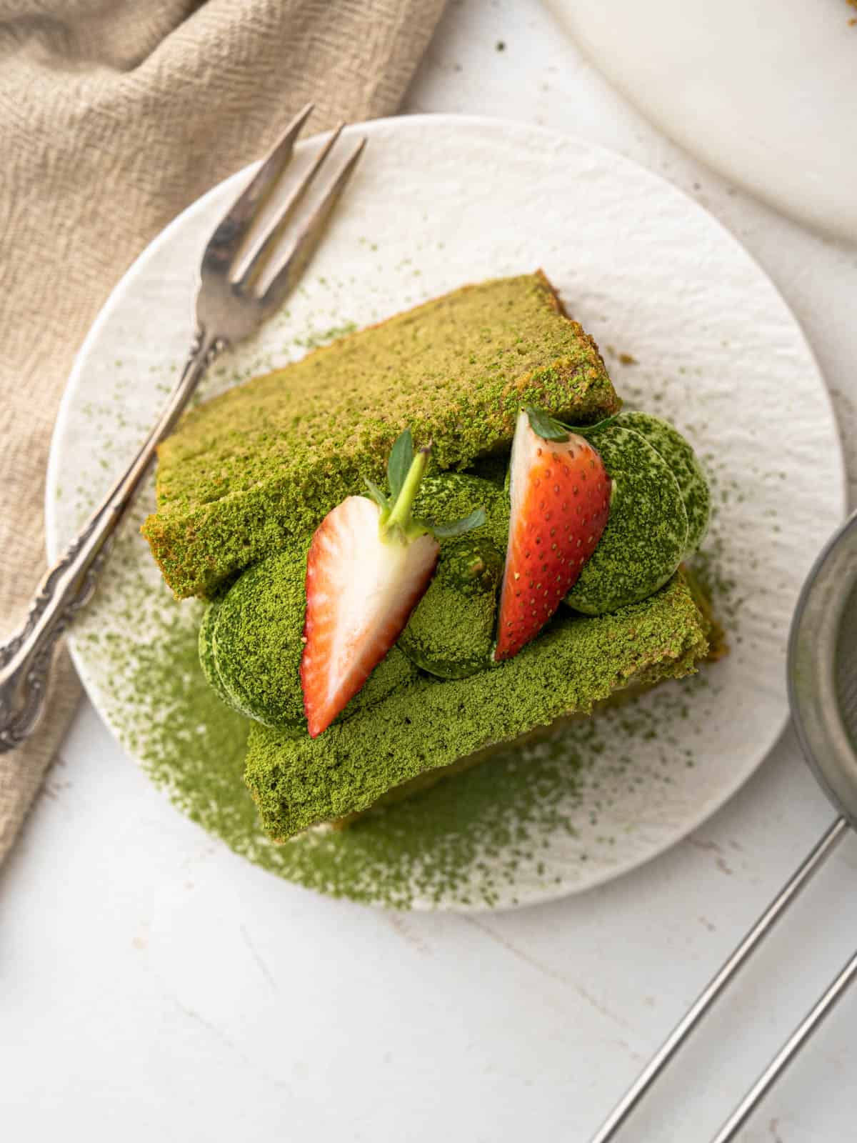 Matcha green tea chiffon sponge cake with whipped cream and strawberries