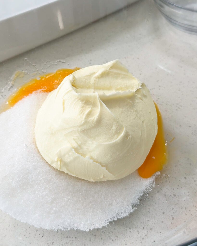 Egg yolks and sugar in bowl - Catherine Zhang Egg yolks and sugar in bowl