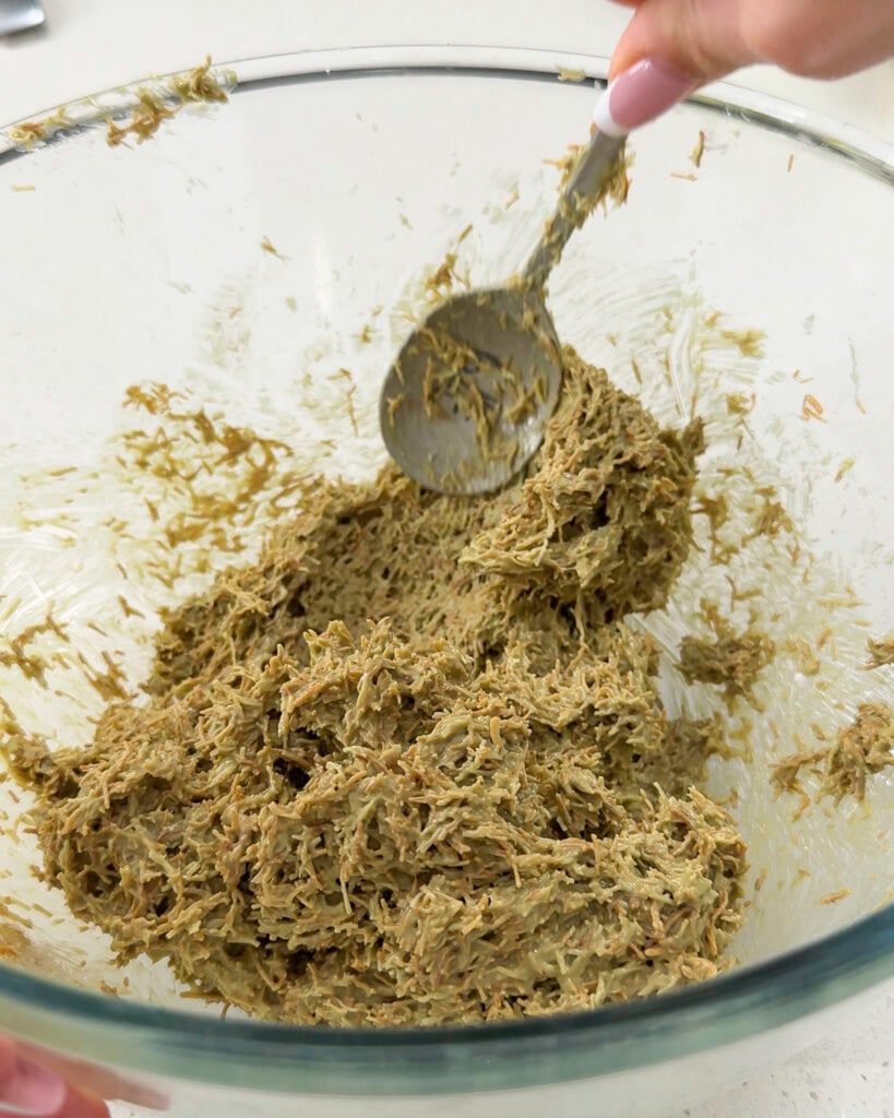 Green paste is visibly being handled with a spoon - Catherine Zhang Green paste is visibly being handled with a spoon