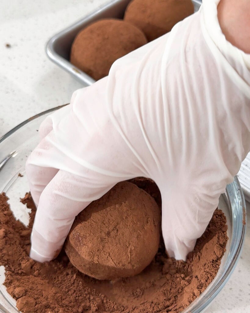 Hand holding a portion of pistachio kataifi filling - Catherine Zhang Hand holding a portion of pistachio kataifi filling