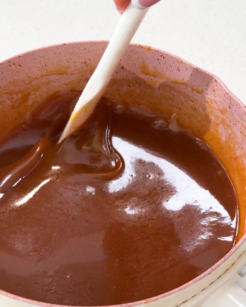 Stirring smooth caramel sauce in saucepan - Catherine Zhang Stirring smooth caramel sauce in saucepan