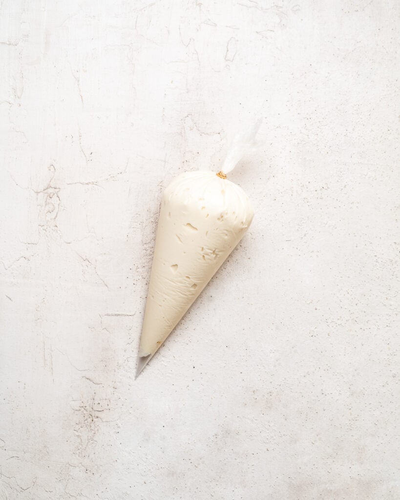 Piping bag filled with smooth white cream filling - Catherine Zhang Piping bag filled with smooth white cream filling
