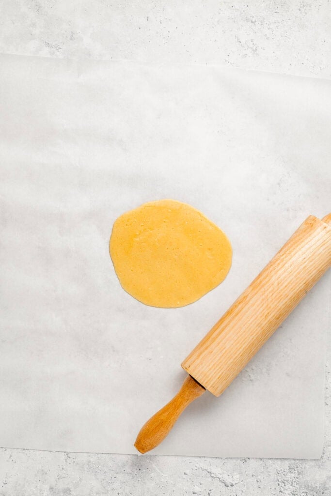 Rolled yellow cookie dough round for Melon Pan topping