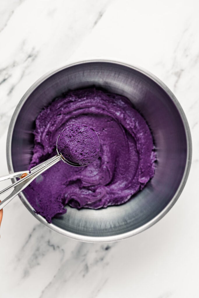 Scooping dark purple cookie dough - Catherine Zhang Scooping dark purple cookie dough