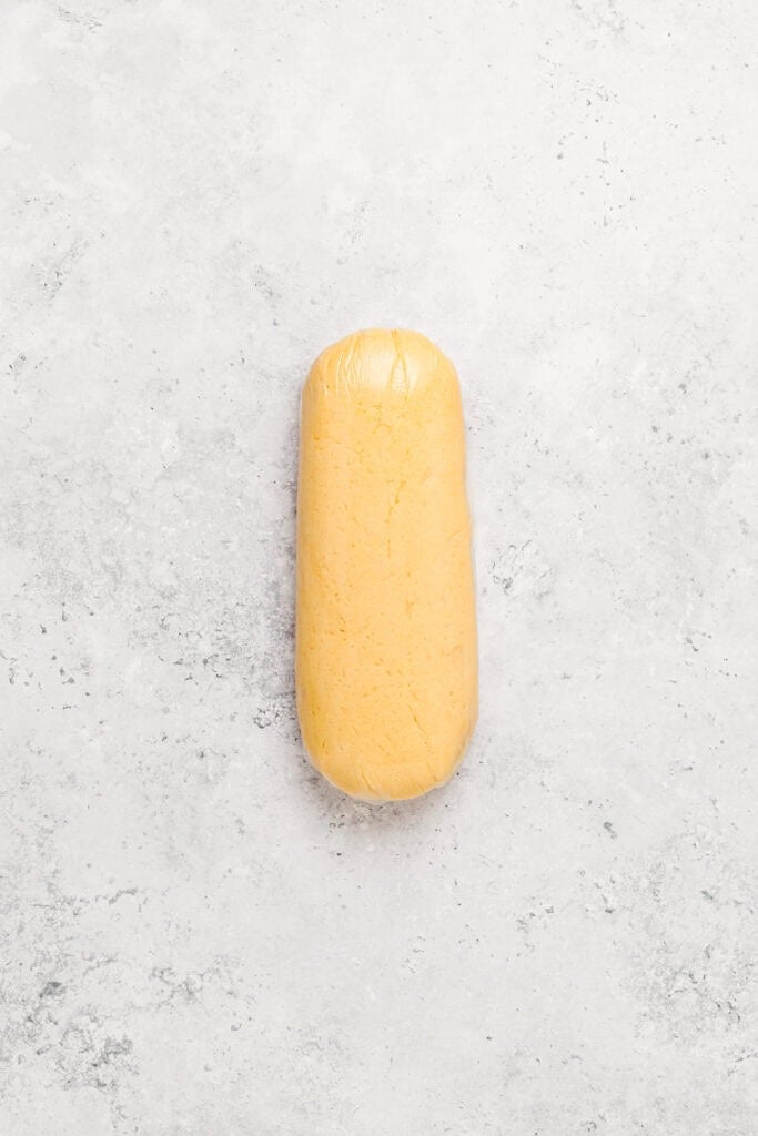 Yellow Melon Pan cookie dough shaped into a cylinder