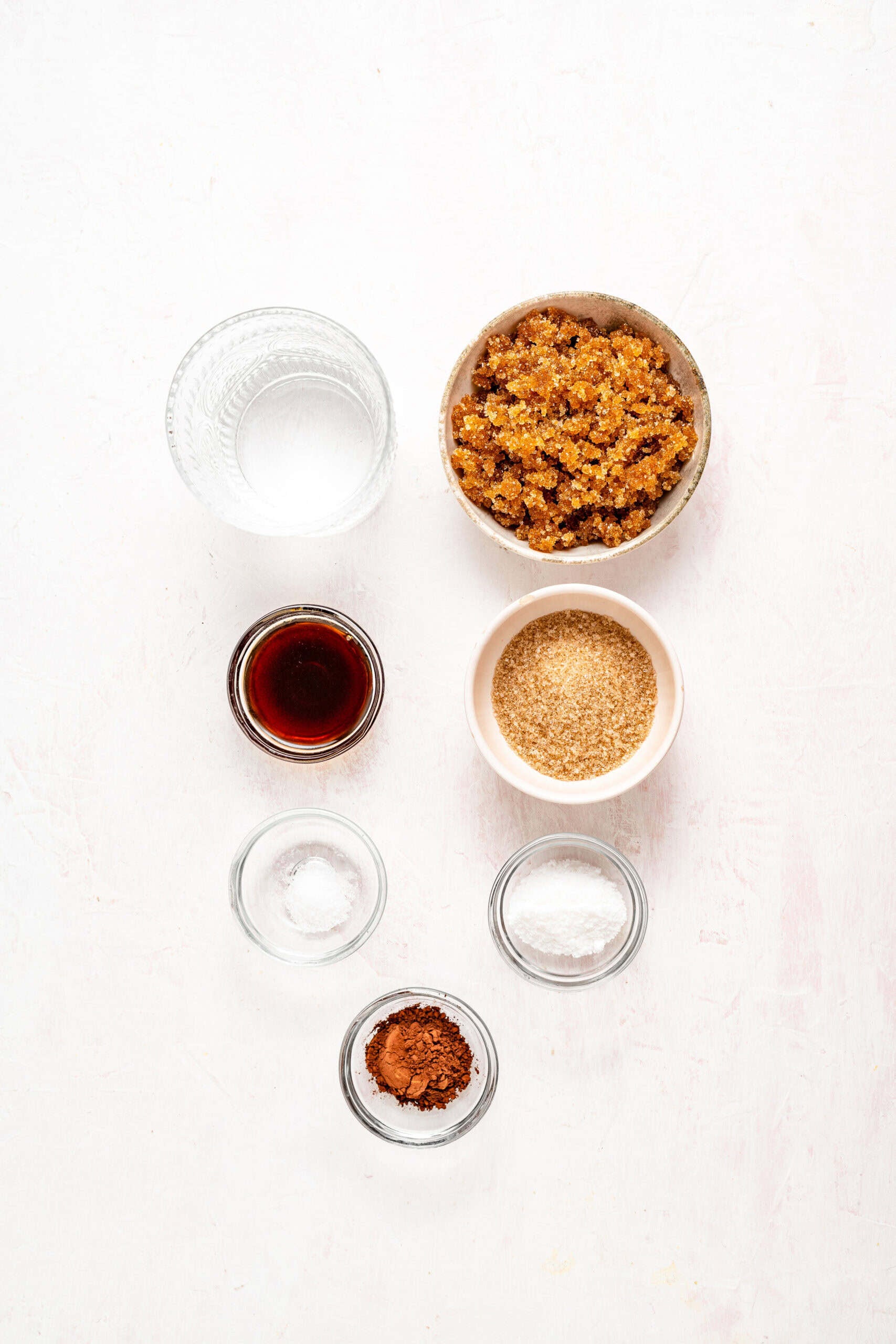 Kuromitsu ingredients flat lay with dark muscovado sugar molasses salt and water - Catherine Zhang Kuromitsu ingredients flat lay with dark muscovado sugar, molasses, salt and water