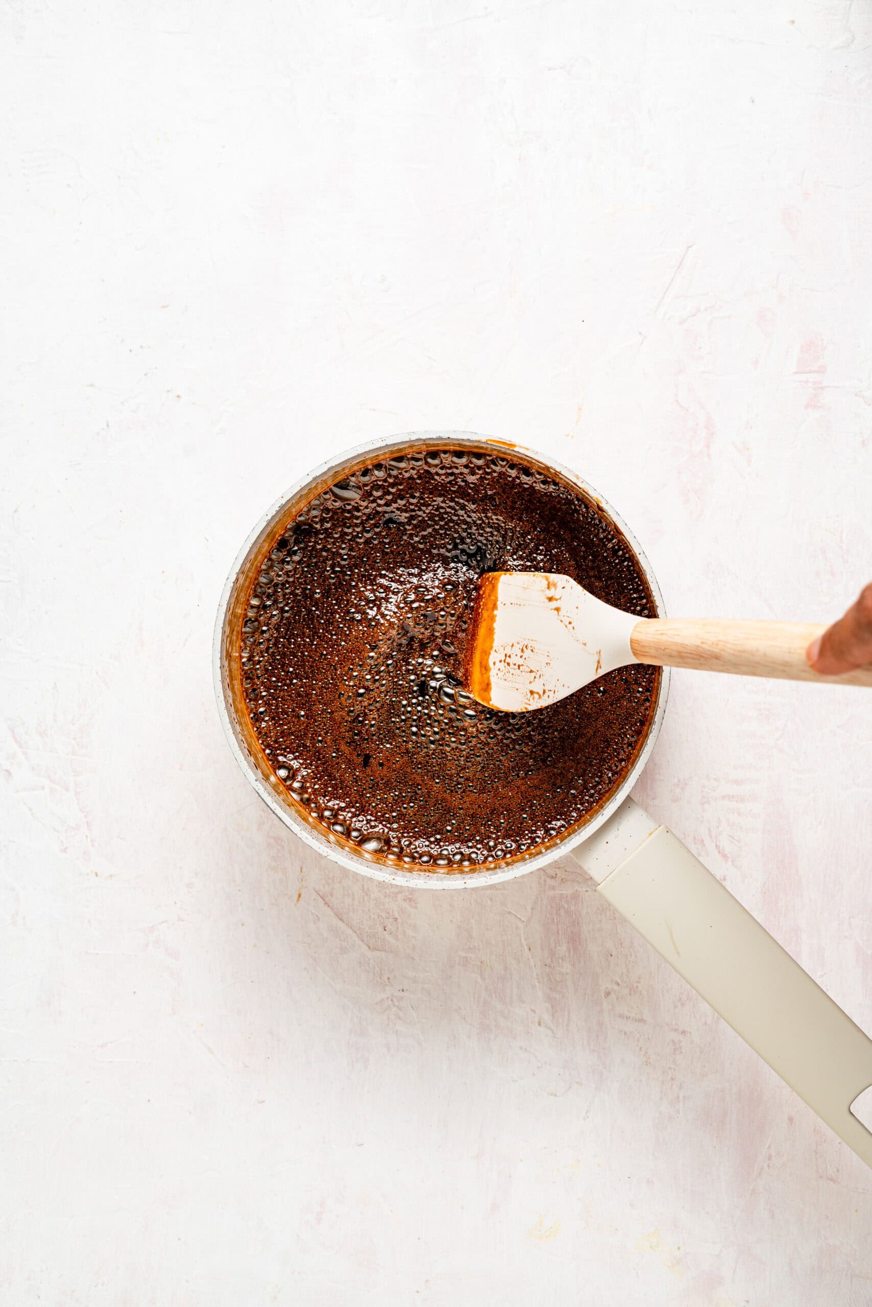 Kuromitsu syrup simmering gently in the saucepan - Catherine Zhang Kuromitsu syrup simmering gently in the saucepan