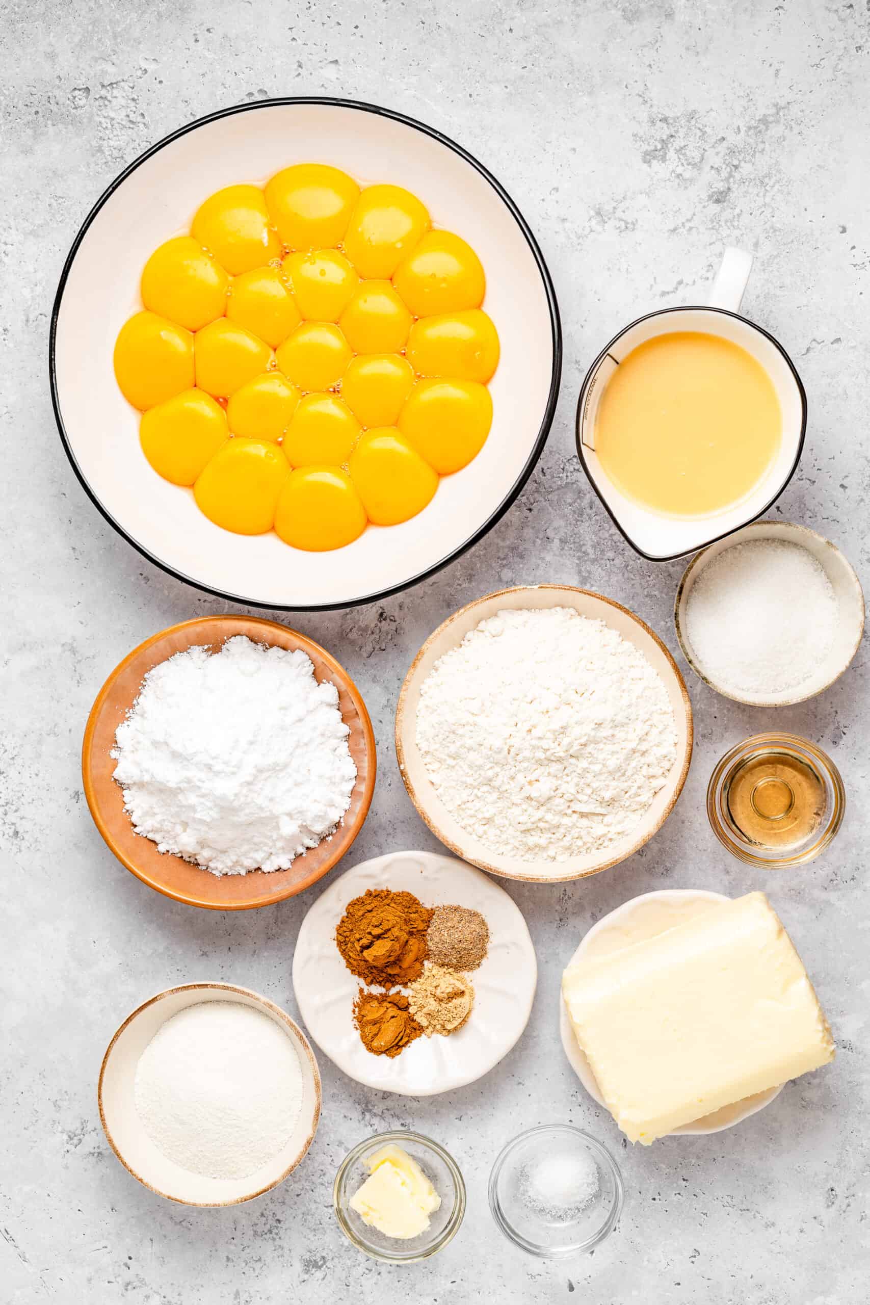 Ingredients for lapis legit including egg yolks, butter, sugar, condensed milk and spices - Catherine Zhang Ingredients for lapis legit including egg yolks, butter, sugar, condensed milk and spices