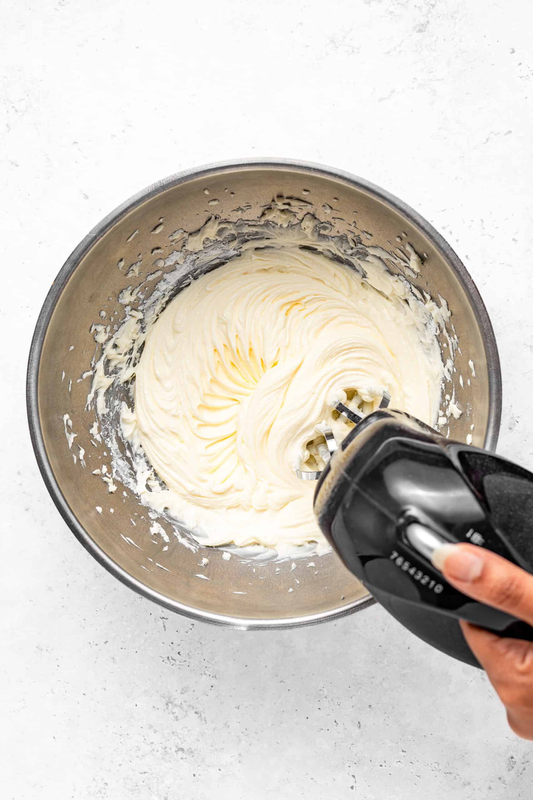 Beating softened butter, icing sugar and condensed milk - Catherine Zhang Beating softened butter, icing sugar and condensed milk