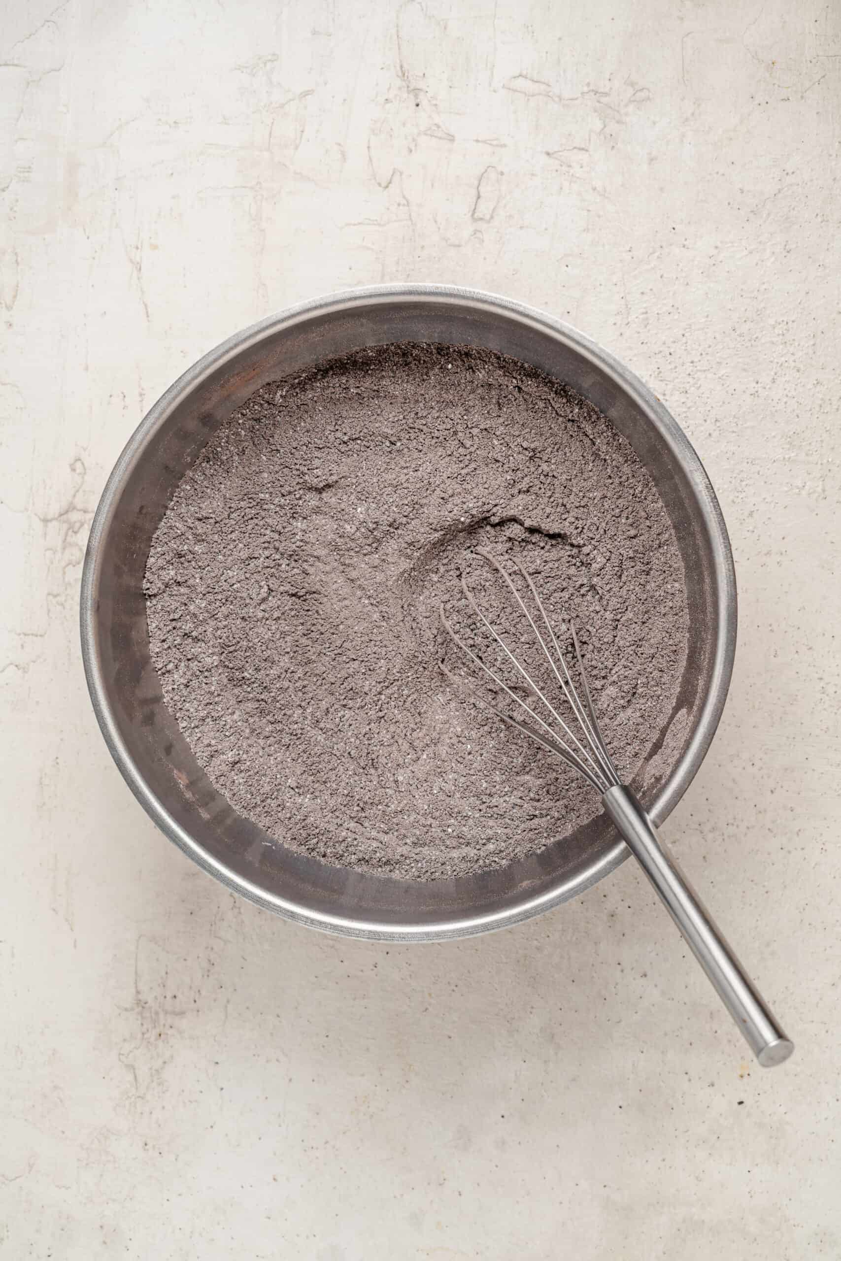 Whisking cocoa and dry ingredients for the chocolate cake - Catherine Zhang Whisking cocoa and dry ingredients for the chocolate cake