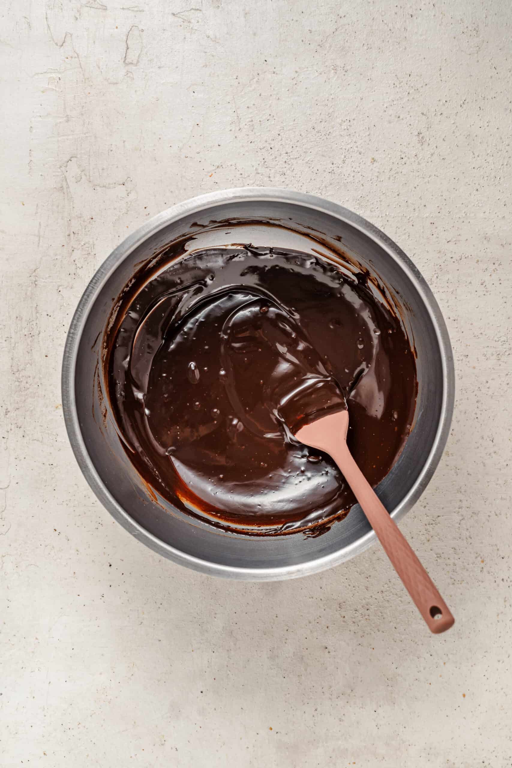 Stirring glossy chocolate ganache for the drip - Catherine Zhang Stirring glossy chocolate ganache for the drip