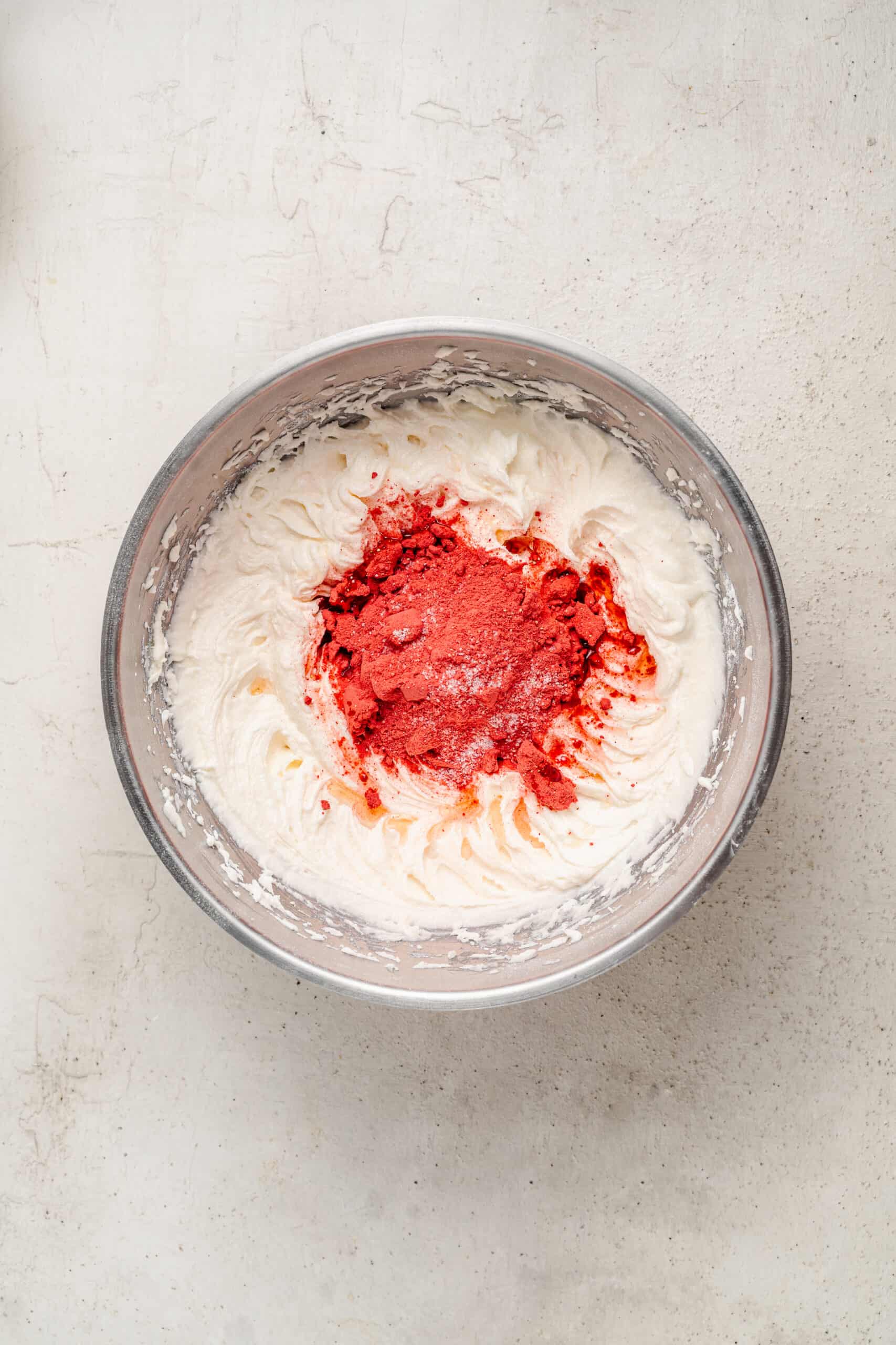 Adding freeze dried strawberry powder to the buttercream - Catherine Zhang Adding freeze dried strawberry powder to the buttercream