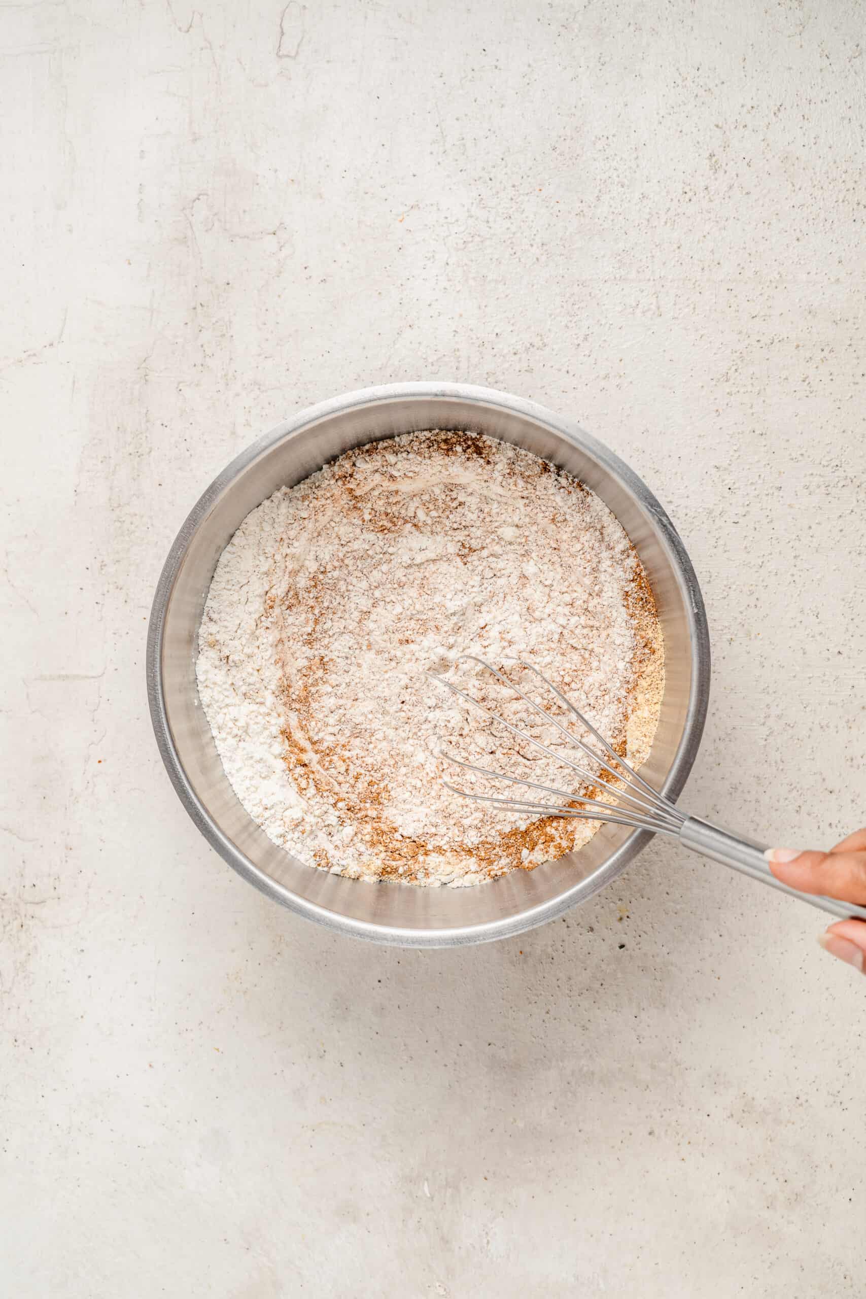 Whisking flour, espresso powder and spices for gingerbread latte cookies - Catherine Zhang Whisking flour, espresso powder and spices for gingerbread latte cookies